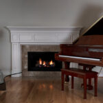 Glowing,Fireplace,With,Baby,Grand,Piano,On,Solid,Red,Oak