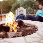 View,Of,Firepit,And,Happy,Smiling,Family,Of,Two,,Father