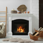 Wicker,Baskets,With,Firewood,And,White,Fireplace,In,Cozy,Living