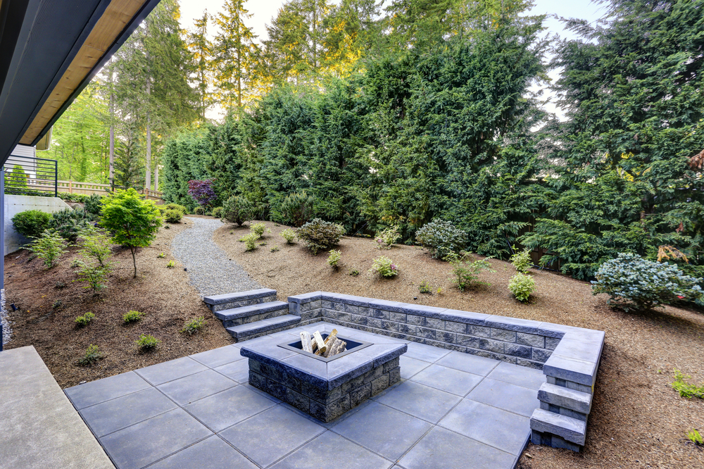 New,Modern,Home,Features,A,Backyard,With,Rectangular,Concrete,Fire